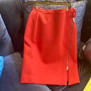 J. Crew orange pencil skirt with adjustable front zipper split.